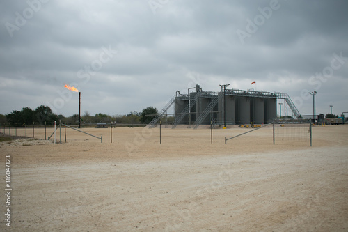 Photography Energy industrial Oil pump oil rig producing oil to a downstream facility in the