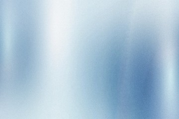 Light blue foil metallic wall with glowing shiny light, abstract texture background