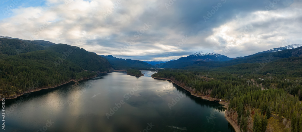 Fototapeta premium Aerial Panoramic View of Daisy Lake and Sea to Sky Highway in the Canadian Mountain Landscape. Taken near Whistler and Squamish, North of Vancouver, BC, Canada.