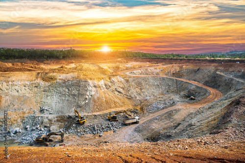 Aerial view of opencast mining quarry with lots of machinery at work - view from above.This area has been mined for copper, silver, gold, and other minerals,Thailand