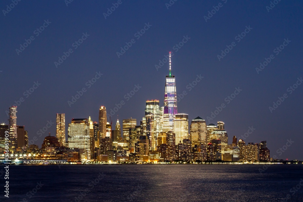 Beautiful skyline of financial district New York city at night, USA