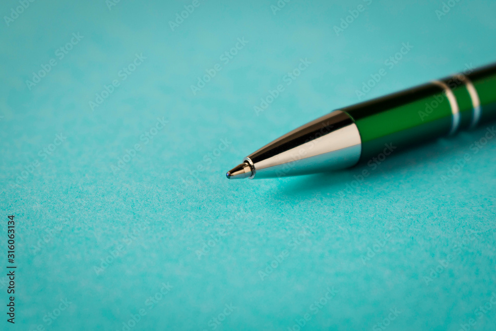 Pen on a blue background. Business supplies. Close up. Pen on a blue background. Business supplies. Close up.