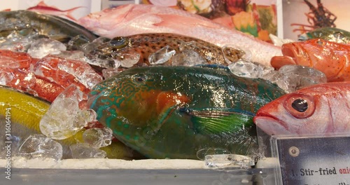 Tropical fishes on shelf, Makishi Market, Okinawa, Japan. 20-1-20  Naha's biggest and most popular market is the Makishi Public Market, filled with various Meat and marine products.