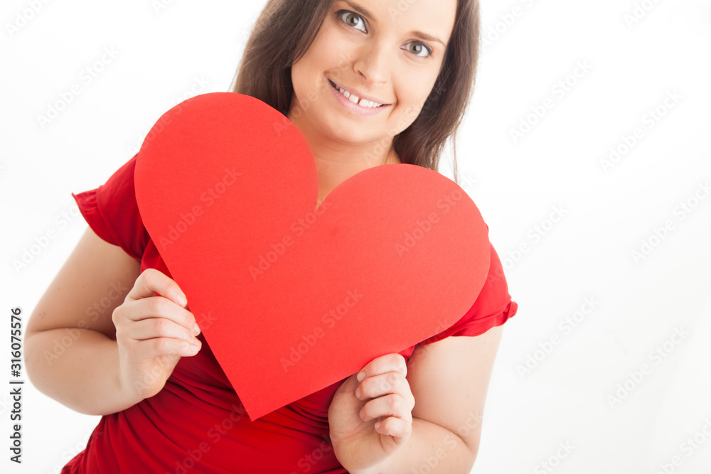 Red love heart held by woman Red love heart held by woman