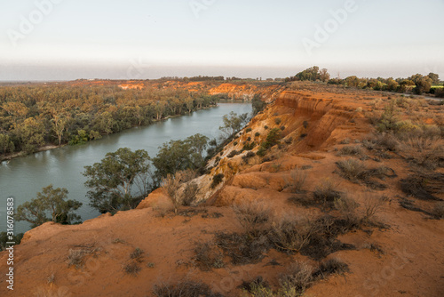 Scenic view to Murray River from rugged cliff top at Murtho lookout in Riverland. Natural South Australian waterfront scenery in Riverland at sunset