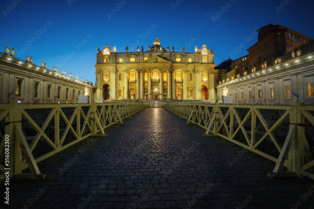 Vatican at night. St. Peter's Cathedral (Basilica di San Pietro) illuminated in the dusk