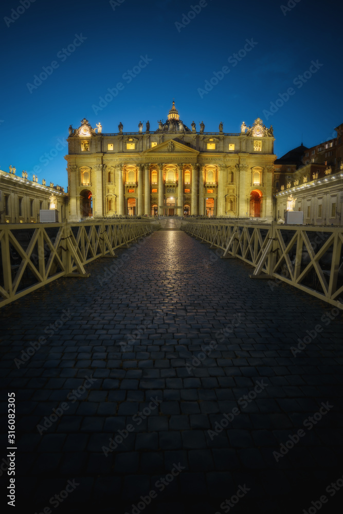 Vatican at night. St. Peter's Cathedral (Basilica di San Pietro) illuminated in the dusk Vatican at night. St. Peter's Cathedral (Basilica di San Pietro) illuminated in the dusk