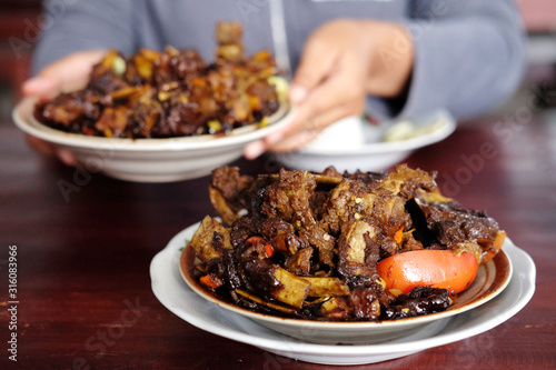 Tengkleng Kambing Pak manto, Solo, Central Java, Indonesia. Traditional Indonesian spicy food made from the bones of goat. photo