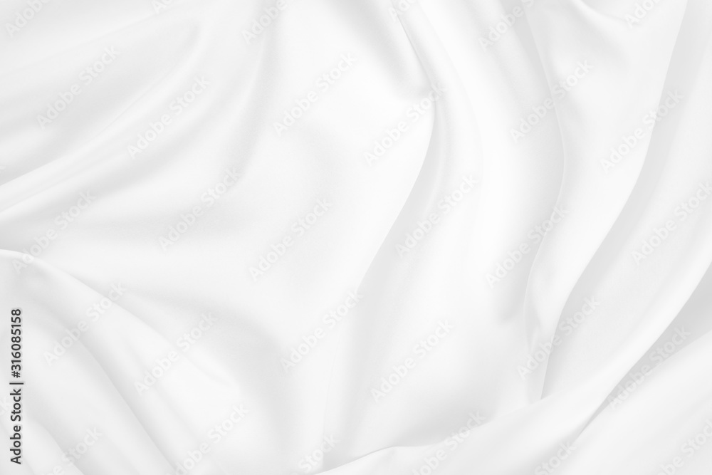 Abstract white fabric texture background. Cloth soft wave. Creases of satin, silk, and cotton.	