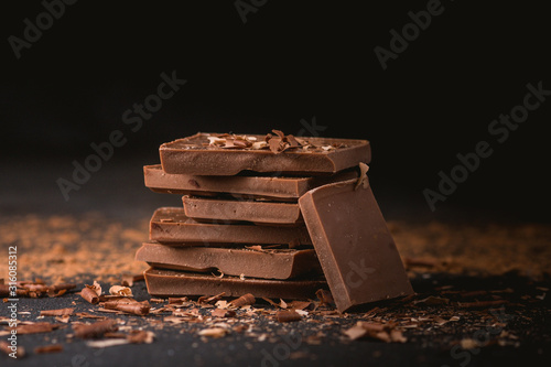 Milk chocolate stack on dark background