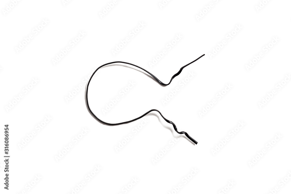 Black used piece of wire for pulling electric cables and other things on a white background isolate. Black plastic coated wire tie. Cable flexible tie tools for packing. Top view. Black used piece of wire for pulling electric cables and other things on a white background isolate. Black plastic coated wire tie. Cable flexible tie tools for packing. Top view.