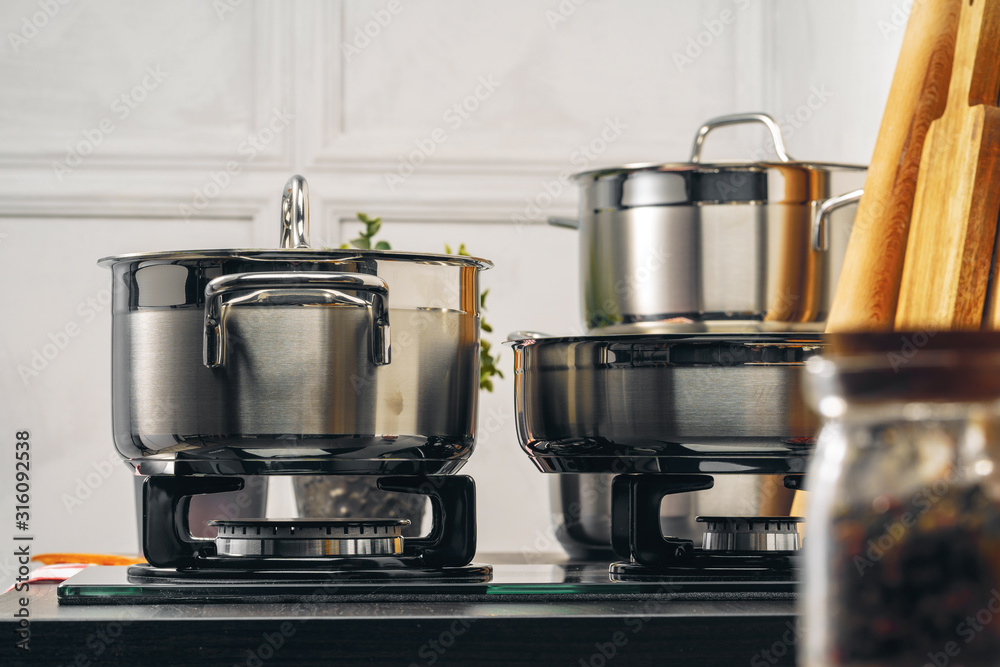 Clean saucepan on a gas stove in kitchen Clean saucepan on a gas stove in kitchen