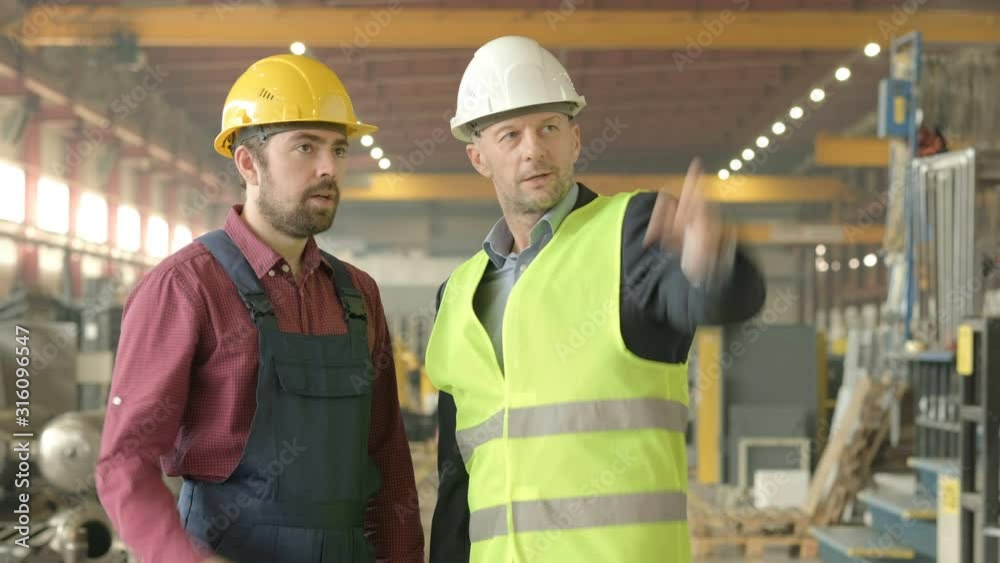 Two men meeting at the factory Two men meeting at the factory
