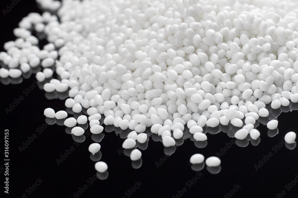 Closeup of a granule of white plastic polymer Closeup of a granule of white plastic polymer