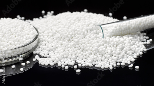 Closeup of a granule of white plastic polymer photo