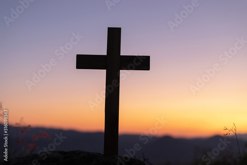 Silhouettes of crucifix symbol with on the colorful sky background