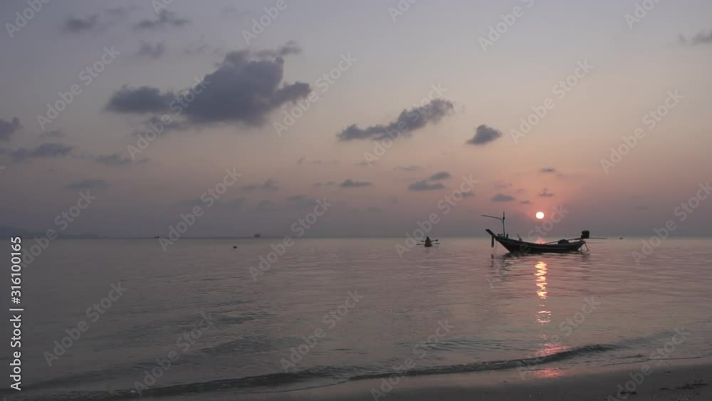 Fishing boats rest in calm waters with big cruise ship in background Fishing boats rest in calm waters with big cruise ship in background