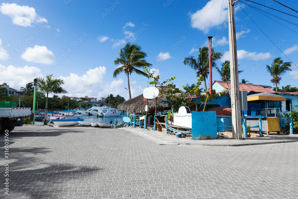 Caribbean town with coast and speedboats