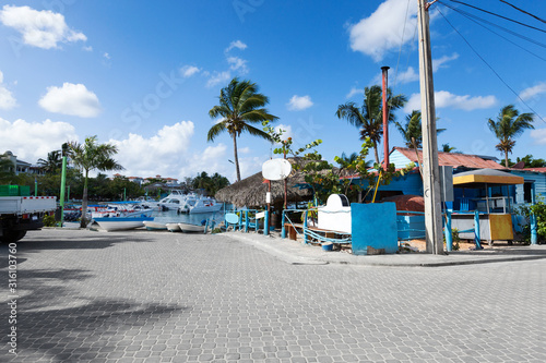 Caribbean town with coast and speedboats