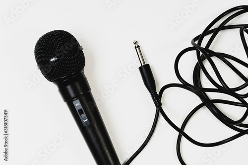 black wired microphone on white background
