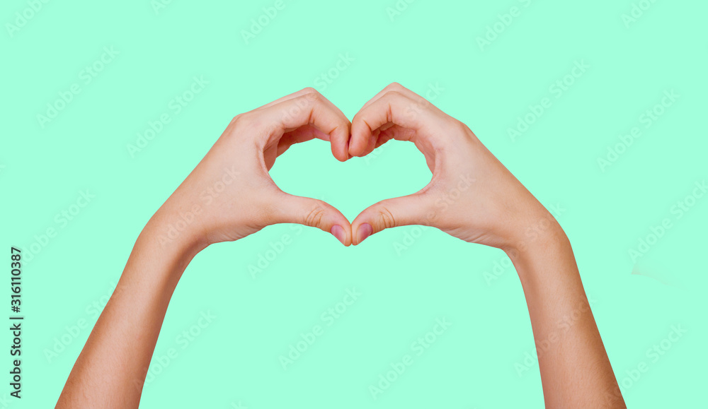Hands show a heart sign. The concept of love, friendship. Sign I Love You. Isolate on a contrasting background. Blank for design. Hands show a heart sign. The concept of love, friendship. Sign I Love You. Isolate on a contrasting background. Blank for design.