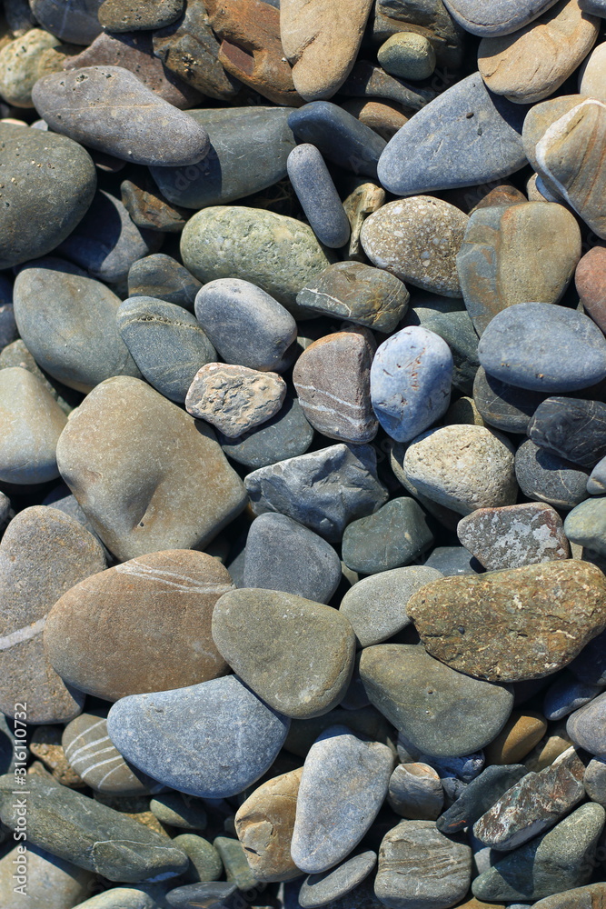 Multi-colored stones on the Black Sea in Sochi Multi-colored stones on the Black Sea in Sochi