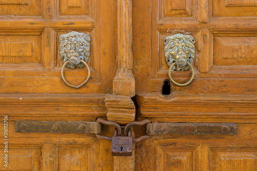 Syros island Greece: Ermoupoli old door knocker on a neoclassical house