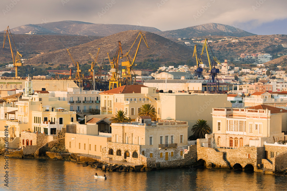 Syros island Greece: Ermoupoli stands on a naturally amphitheatrical site, with neoclassical buildings, old mansions, and white houses cascading down to the harbor.
