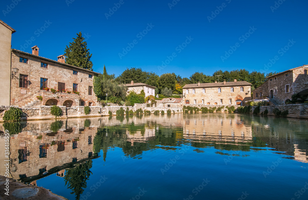 View of antique thermal baths in the medieval village Bagno Vignoni, Tuscany, Italy