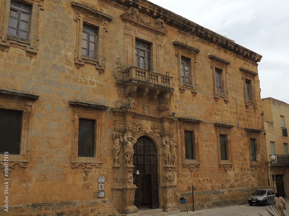 Mazara del Vallo – Jesuit college facade with the column of the portal and yellow stone wall