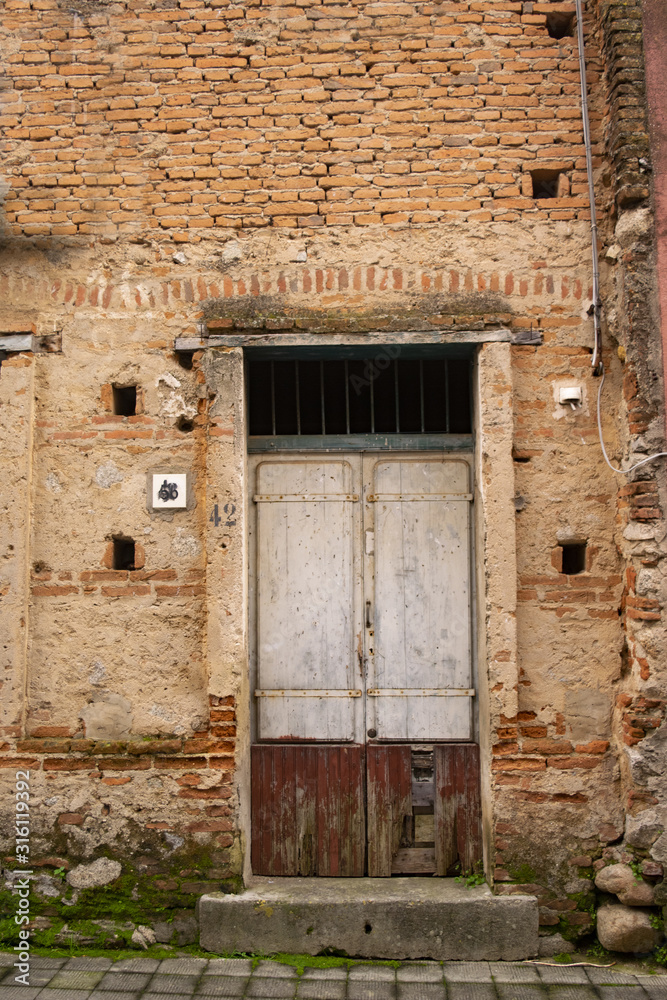 old main door of an abandoned house