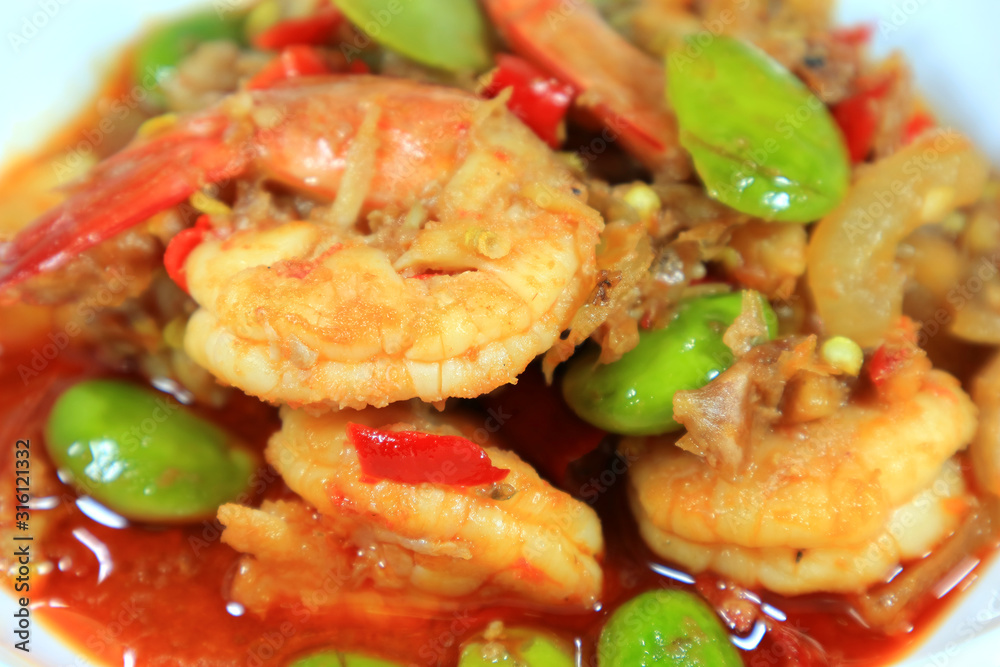 Closeup Hot and Spicy Thai Southern Region Dish of Stir Fried Parkia Nuts with Shrimps Closeup Hot and Spicy Thai Southern Region Dish of Stir Fried Parkia Nuts with Shrimps