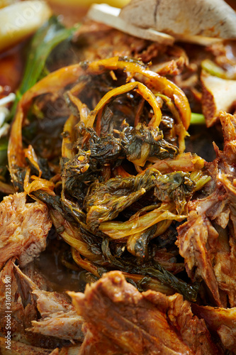 Korean spicy braised pork and leaf vegetable 