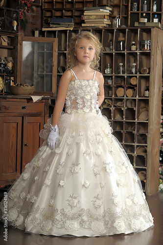 Princess in a white dress. Flowergirl, event.