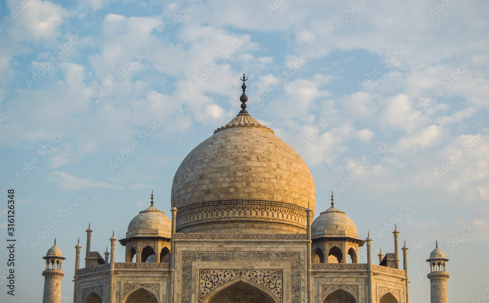 Front view of the mausoleum of Taj Mahal during the sunrise in Agra, Uttar Pradesh, India