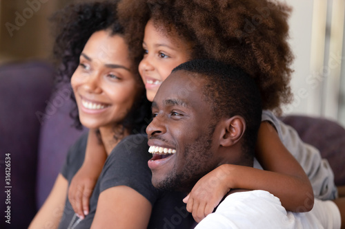 Excited African American family dream of bright future together