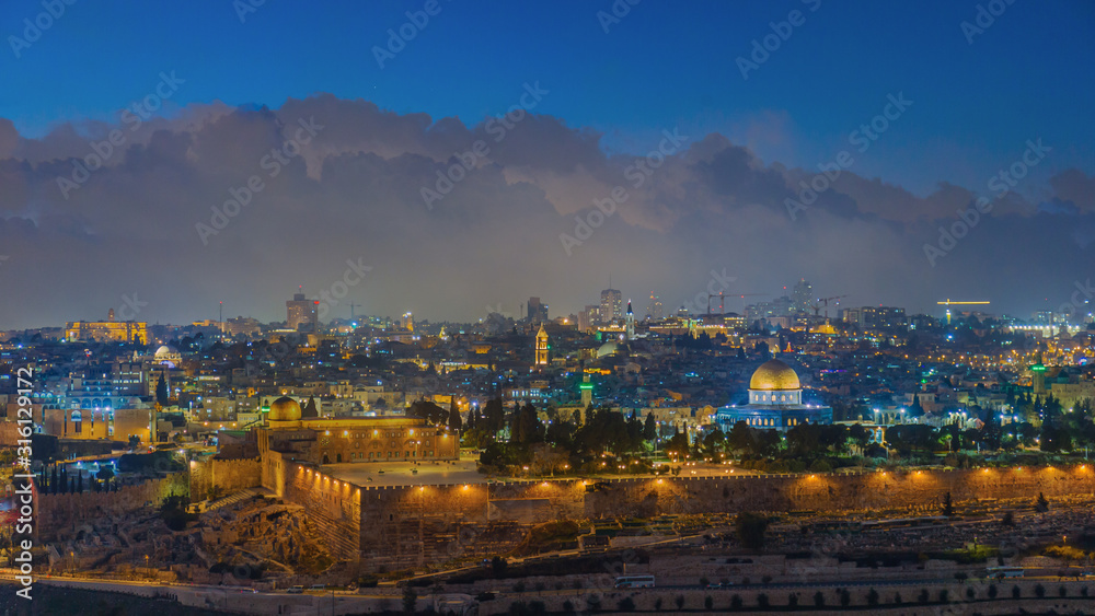 Naklejka premium Illuminated skyline of the old city of Jerusalem at dusk - Israel