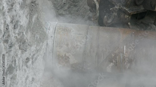 Horizontal drill rig cutting utilities tunnel into limestone rock
