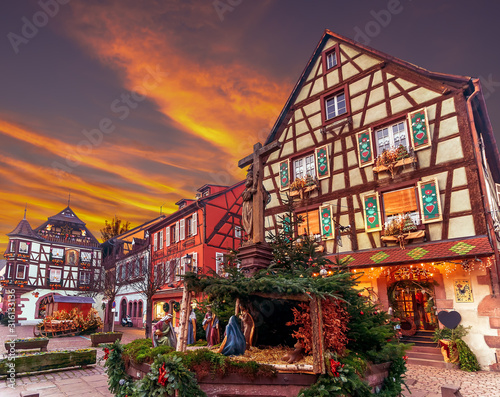 Traditional colorful house in Kaysersberg, Alsace, decorated at Christmas, France photo