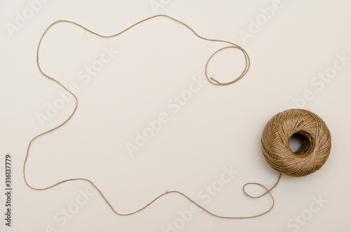 Hemp cord, jute twine on white paper backgound
