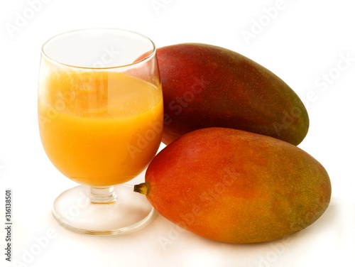 tropical fruits mangoes and smoothie as tasty dessert