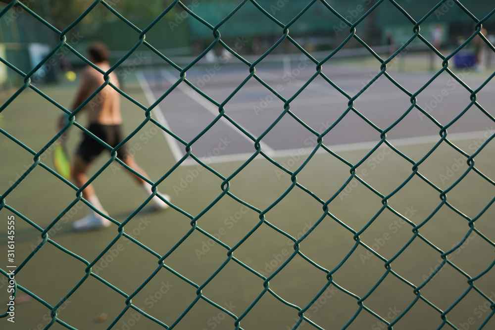 chain link fence on a background of blue sky chain link fence on a background of blue sky