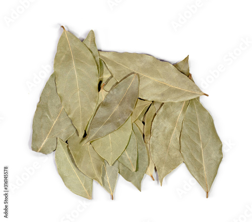 heap of leaves of bay leaf isolated on a white background top view