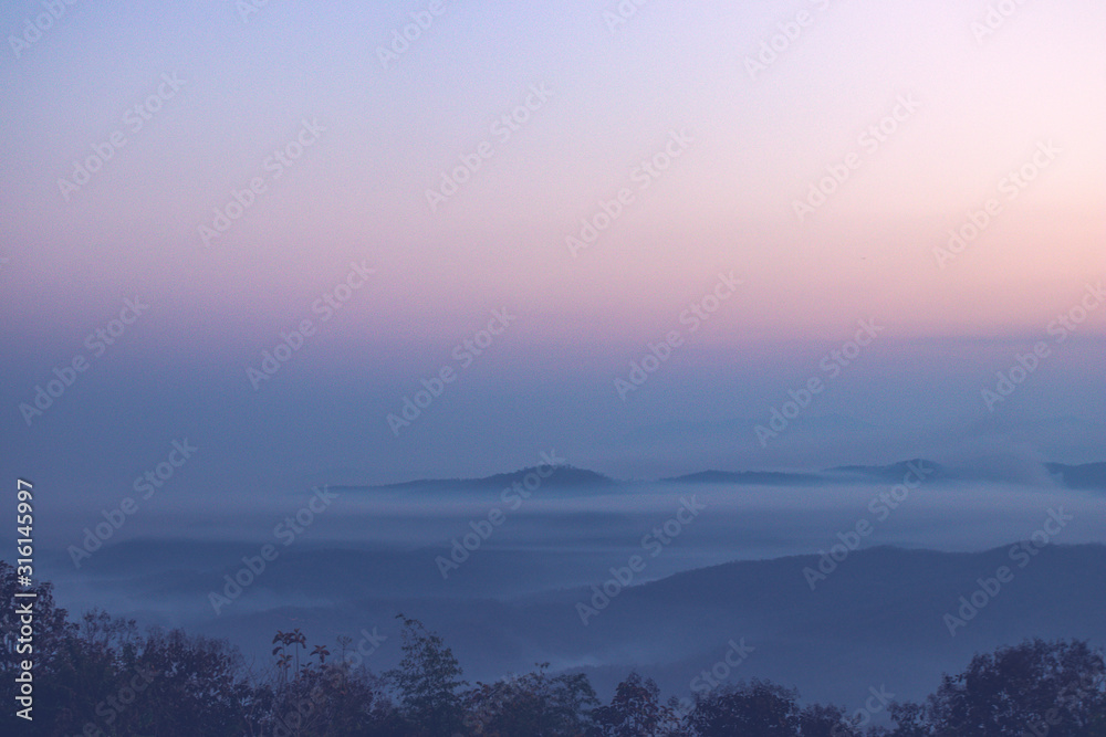 Layers of mountain with mist and twight light