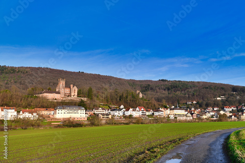 View on Odenwalf forest with buildings and well preserved and inhabited medieval German hill castle called 'Mittelburg', in German city Neckarsteinach