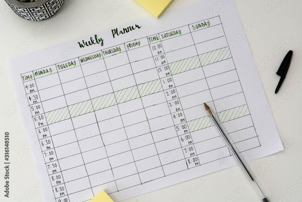 Flat lay image of weekly planner with stationary scattered around. Revision timetable for exams or activity planner. Flat lay image of weekly planner with stationary scattered around. Revision timetable for exams or activity planner.