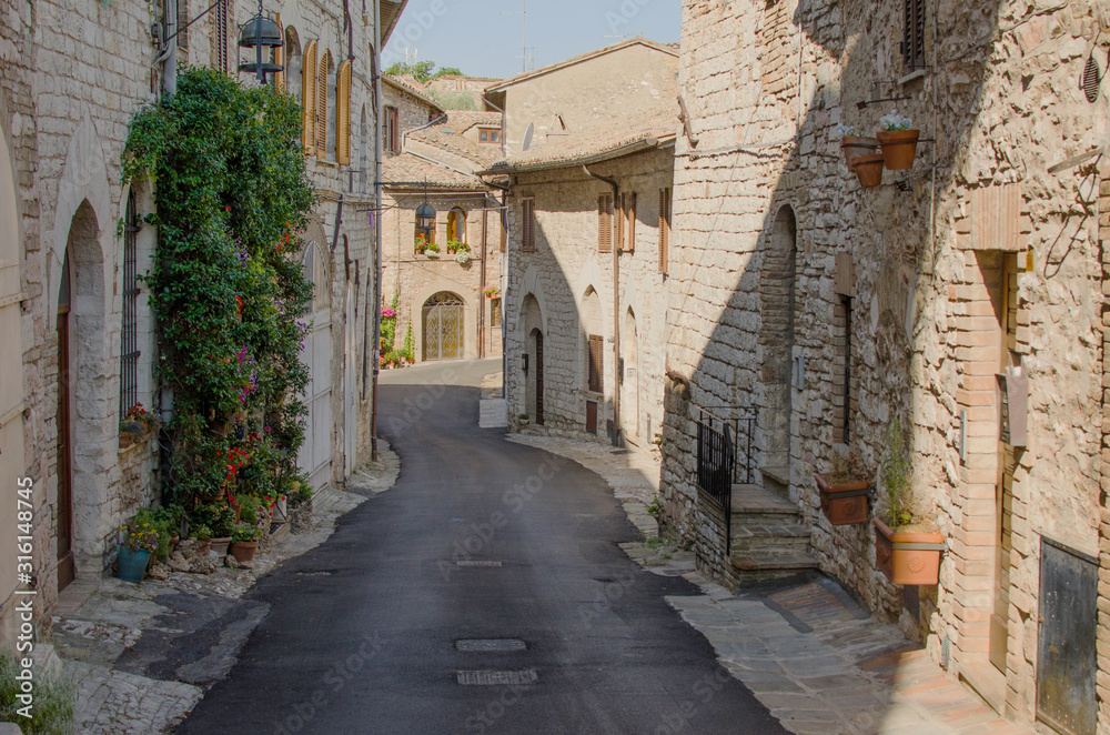 A medieval picturesque street in Assisi, Italy