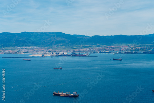 scenery. blue ocean and afar ships and mountains