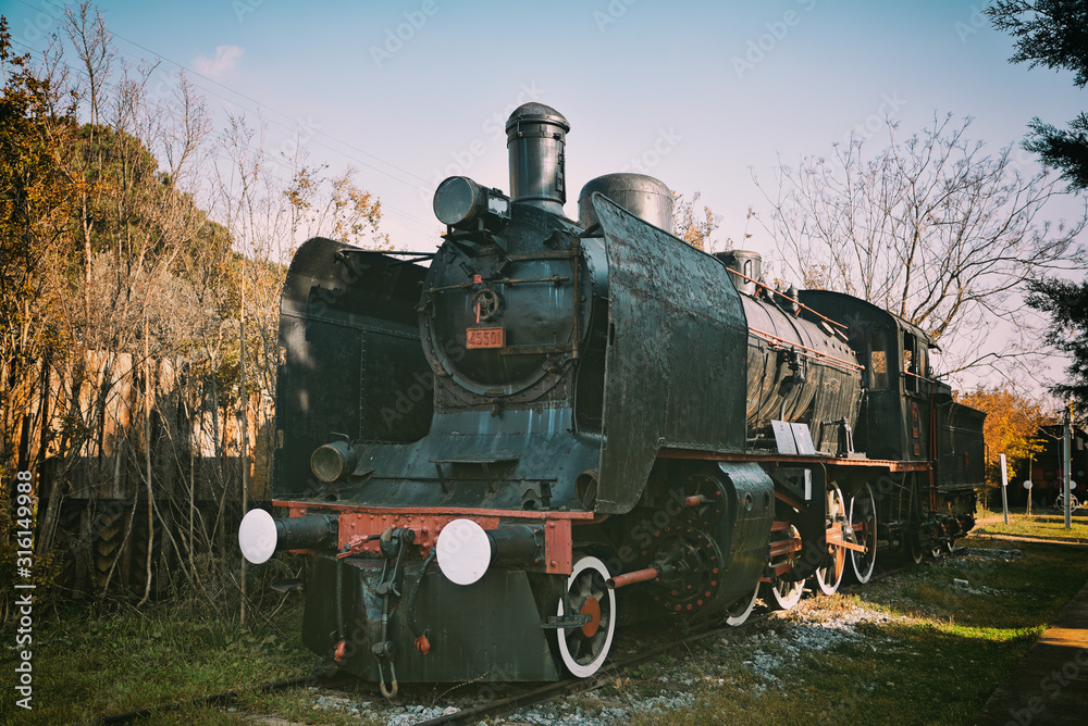 Naklejka premium Railroad history, old steam locomotive.