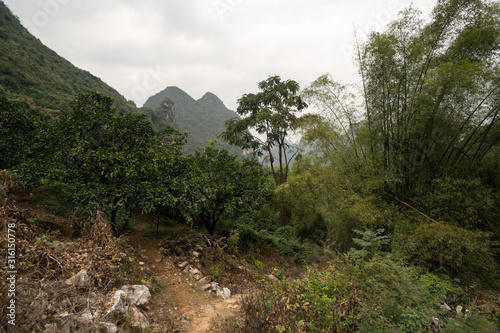 Hiking in the Karst mountains in Guilin region of South China, close to Xingping village, Li River